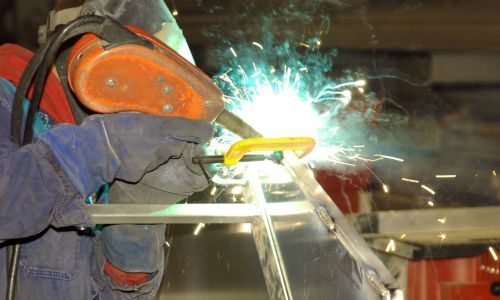 worker welding the metal